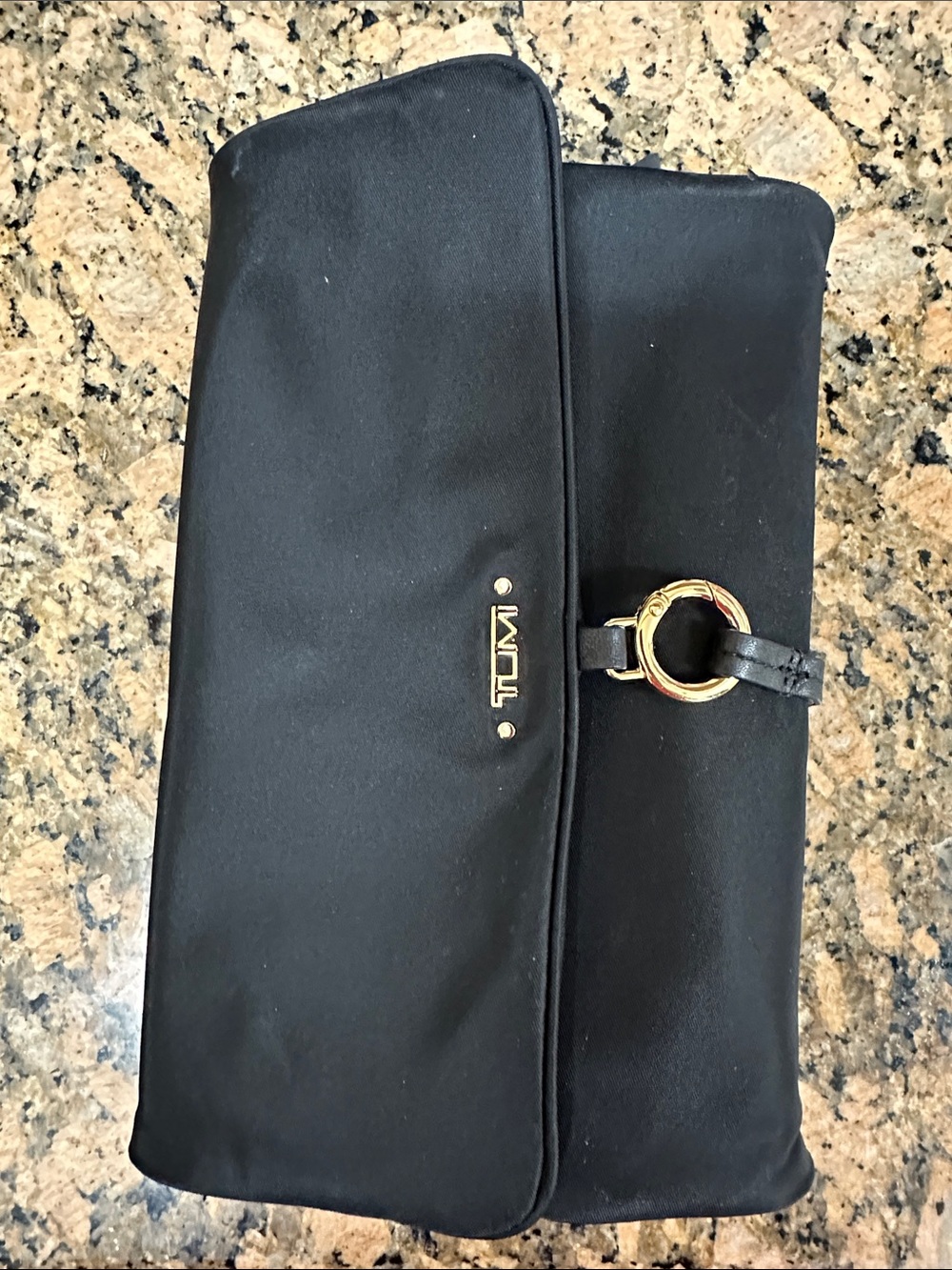 Tumi Black jewelry holder with Gold Ring Accent